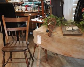 There is a collection of oak side chairs, w/o arms. 