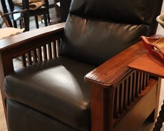 A pair of Mission design, recliners with dark brown leather and oak arms