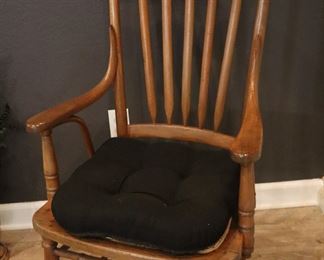 Oak, vintage arm chair for dining; she has a large group of individual chairs to place around a dining table.
