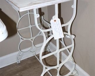 Base to vintage treadle sewing machine painted white