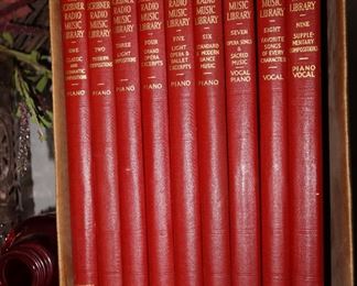 9 volumes, red leather books on music