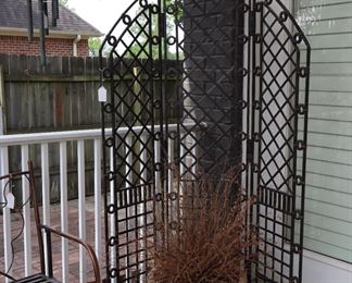 Metal screen, bench, and wind chimes