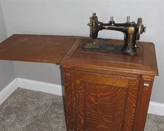 Antique Sewing Machine in Cabinet