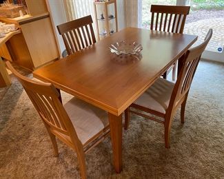 Arhaus Cherry Dining Set w/ 4 Chairs                                         Table dimensions 59” L, 35.5 W, 30.5 tall. 
Two self stored extensions 35.5” each. Can use one at a time or both for a total of 130” long. 
