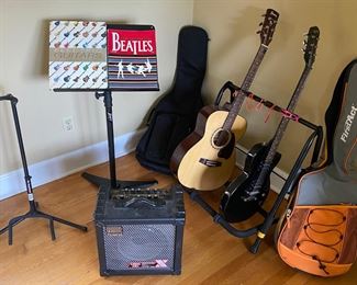 Guitars, guitar stands, amplifier, music stands