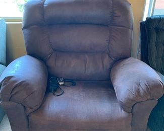Large, plush recliner with remote control.