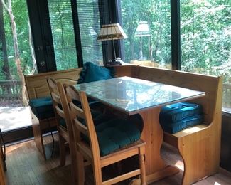 This table is a part of the large game/entertaining tables.  There are 2 chairs and two benches that go with each table.  The bench seat can open up for storage. Where the two benches connect is a Tiffany style lamp bolted into the adjoining piece. 