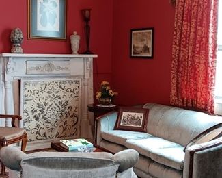 Ornate mantle decoration only. 40's sofa and matching chair.