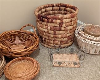 Large collection of bamboo, rattan, seagrass, and reed woven baskets