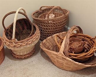 Large collection of bamboo, rattan, seagrass, and reed woven baskets