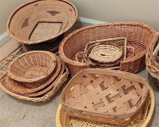 Large collection of bamboo, rattan, seagrass, and reed woven baskets