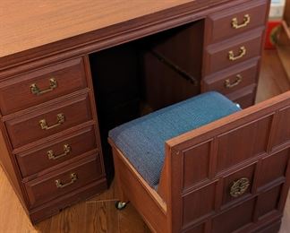 Custom craft and sewing table with built-in chair and storage