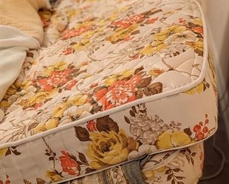 King-sized adjustable bed with attached remote controls