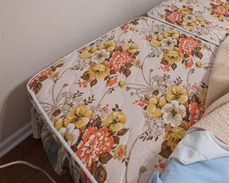 King-sized adjustable bed with attached remote controls