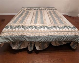 King-sized adjustable bed with attached remote controls