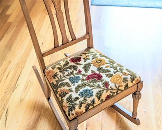 Vintage rocking chair with embroidered seat