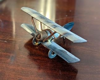 unique spark plug and metal bi-wing plane