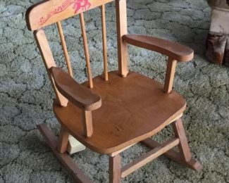 Musical child’s rocking chair.