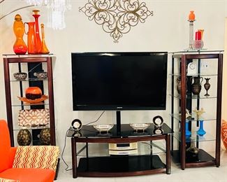 Large TV with tv stand and side display shelves
