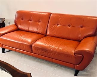 Mid Century Leather Sofa.  Orange color. Perfect for a UT Longhorn fan!! 