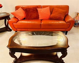 2 end tables and 1 coffee table that match.  And a Mid Century Leather Sofa. 