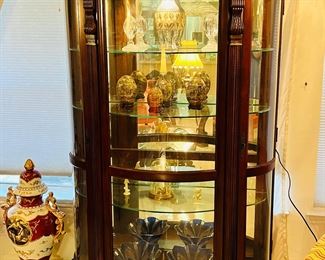 Gorgeous curved glass large curio cabinet. 