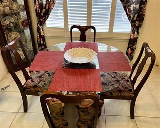 Glass top kitchen table with four chairs 