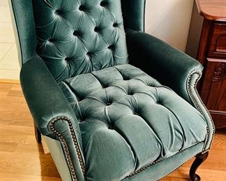 Soft, comfortable green winged back chair