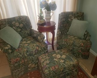 A nice set of floral upholstered chairs and ottoman