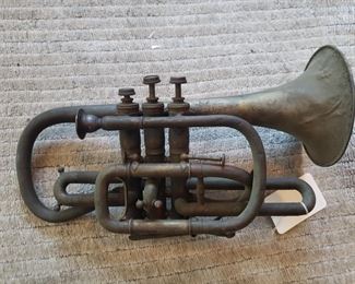 I believe this is a Cornet- it needs a LOT of love but it is cool