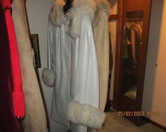 Lots and lots of vintage clothes (leather coats with blue fox fur trim)