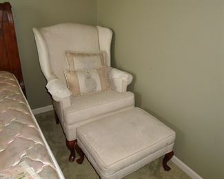 Occasional chair with footstool