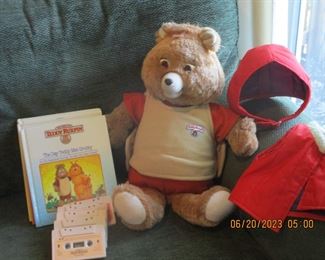 Teddy Ruxpin bear with cassette tapes and books and outer wear  Works great!