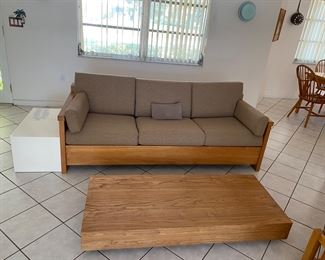Wood and upholstered hide a bed couch with handmade coffee table  55" x 24"  with nesting side table 7" X 14"