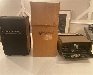 Vintage Bell & Howell slide projector, packaging & slide case