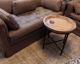 Striped couch and love seat
Round small table
Neutral rug