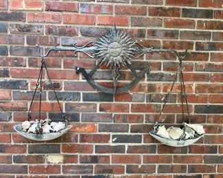scale wall hanging w/sun face