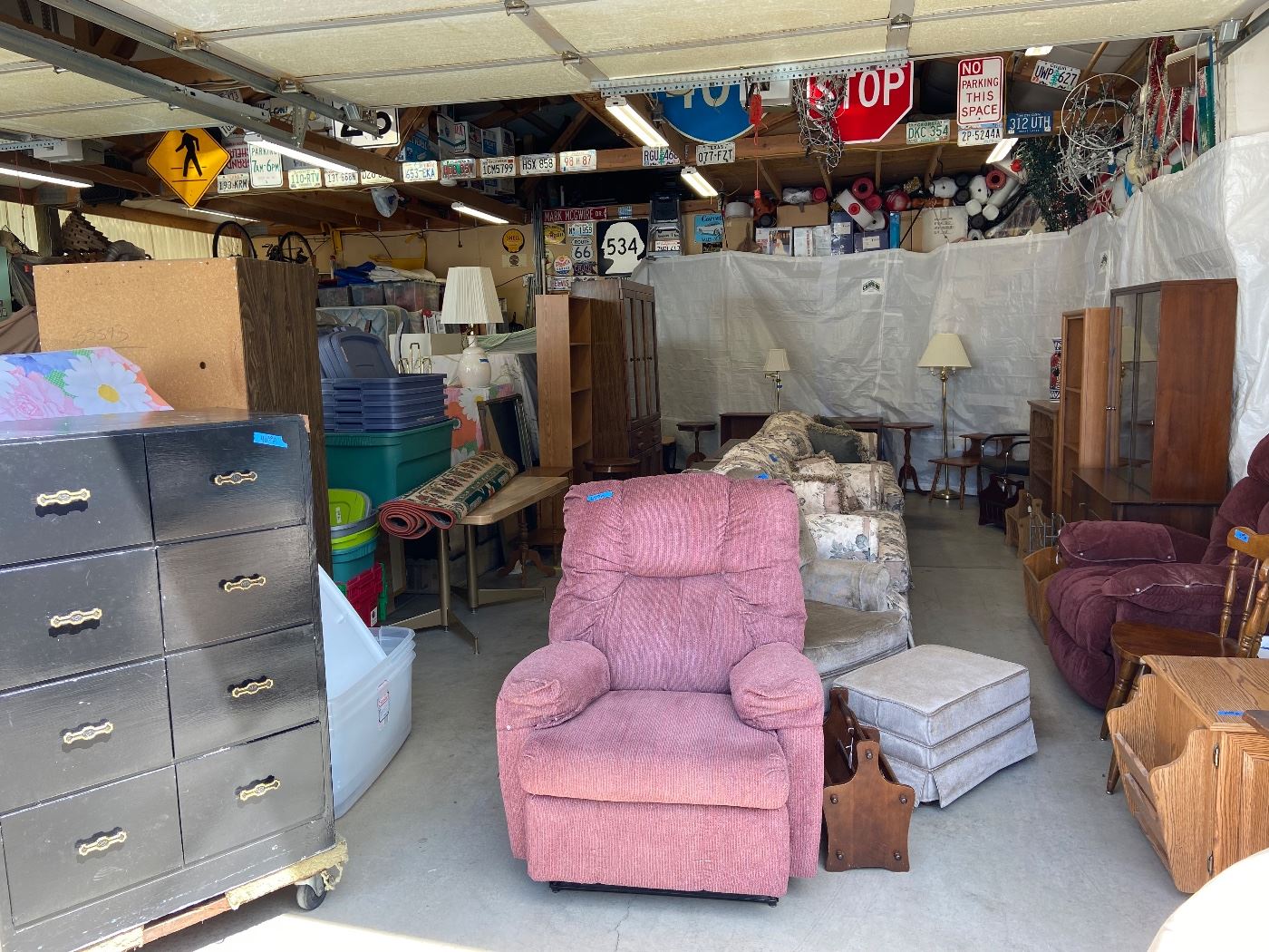 Hard to see but in this pic 2 recliners, swivel rocker with ottoman , couch, love seat, 2 china hutches, several book shelves and side tables and lamps and magazine racks