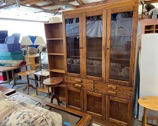 one of the beautiful china hutches and the couch table 