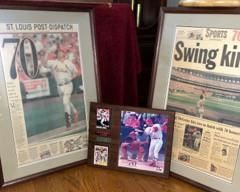 Framed St. Louis Dispatch front pages when Mark McGwire hit 70 homeruns. Mark McGwire plaque with two baseball cards.