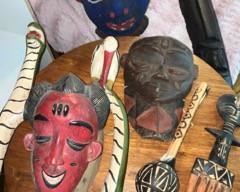 Various African masks and fertility comb