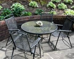 Round patio table with four chairs