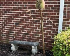 Concrete bench with a pond etched on the seat