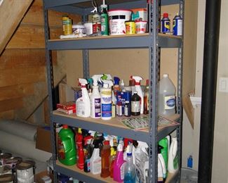 Storage rack with lots of cleaning supplies, and shop needs