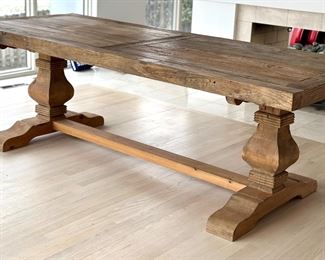 Olde Door Company Emma Dining Room Table in Natural Wood. Crafted from old doors with some dating back hundreds of years is what makes Old Door products so special and unique, textures and depth that only come with age. Created and aged in nature, refined by humans hands. 

Features a reclaimed elm top paired with a pine base. Measures 36” x 94” x 31” 