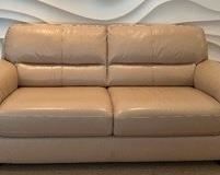 Neutral Colored Leather Sofa in very good condition. Measures 75" x 35"
