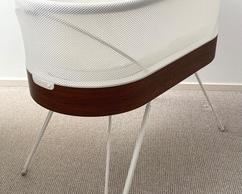 Snoo Smart Sleeper by Happiest Baby including 4 attachable sleep sacks. One size small, 2 size medium and one in a size large. There is one small area with a few white marks.