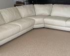 Gorgeous Cream Natuzzi Editions Sectional that measures 35 inches tall, 37 inches deep, the left side is 111 inches and the right side is 117 inches. There is some light wear.