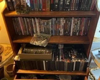 DVDs and small bookshelf.