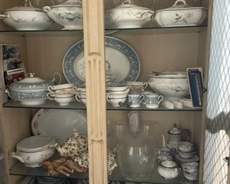 Several sets of china and crystal.